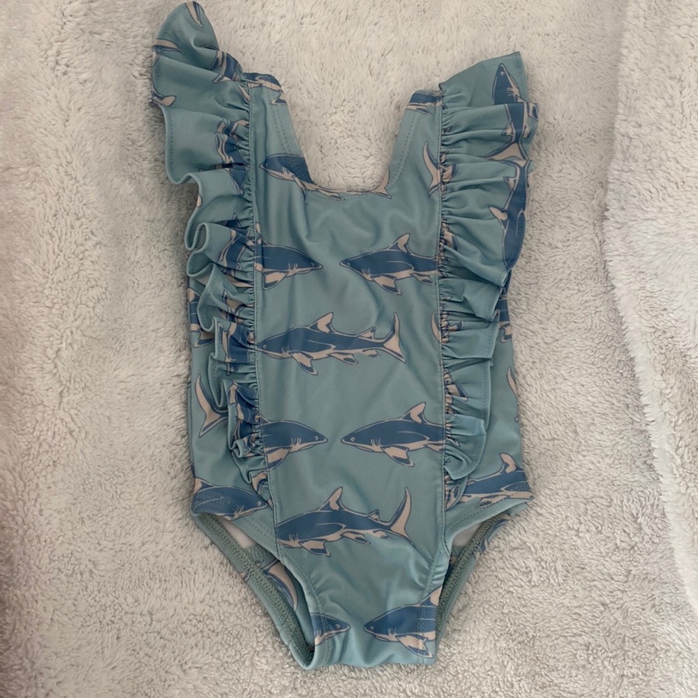 Kate Quinn side ruffle shark swimsuit